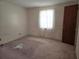 Bedroom exhibiting natural light from one window and electrical outlets, but needs repair and renovation at 613 Chestnut St, Oldsmar, FL 34677