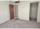 Shows bedroom with damaged ceiling, flooring, and dirty walls; needs repair and renovation at 613 Chestnut St, Oldsmar, FL 34677