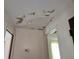 Ceiling showing water damage, adjacent to two doorways at 613 Chestnut St, Oldsmar, FL 34677