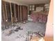 Demolished interior space with exposed framing and remnants of a prior renovation project at 613 Chestnut St, Oldsmar, FL 34677