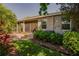 A paver patio, leads to a screened porch and lush landscaped yard, with tranquil outdoor spaces at 6312 Lantern View Pl, Apollo Beach, FL 33572