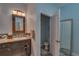 Stylish bathroom with granite countertop, modern fixtures, and a separate toilet room at 6312 Lantern View Pl, Apollo Beach, FL 33572