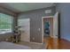 Bedroom featuring an enclosed closet, gray walls and carpet, and a pet tree at 6312 Lantern View Pl, Apollo Beach, FL 33572