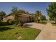 Landscaped front yard and two-car garage of this single-story home on a corner lot at 6312 Lantern View Pl, Apollo Beach, FL 33572