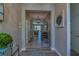 Open-concept foyer featuring hardwood floors and a view into the living and dining areas at 6312 Lantern View Pl, Apollo Beach, FL 33572
