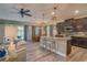 Open concept kitchen with granite countertops, stainless steel appliances and adjacent breakfast nook, Gathering room at 6312 Lantern View Pl, Apollo Beach, FL 33572