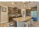 Spacious kitchen boasts granite countertops, stainless steel appliances, an island with seating, and ample cabinet space at 6312 Lantern View Pl, Apollo Beach, FL 33572