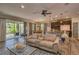 Open concept living area with sliding glass doors, dining area, and a modern kitchen at 6312 Lantern View Pl, Apollo Beach, FL 33572