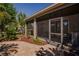 A paver patio, leads to a screened porch and lush landscaped yard, offering a tranquil outdoor space at 6312 Lantern View Pl, Apollo Beach, FL 33572