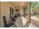 Relaxing screened patio featuring an outdoor mini-bar with cooler, comfortable seating, and tranquil views at 6312 Lantern View Pl, Apollo Beach, FL 33572