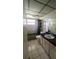 Modest bathroom with a tub, toilet, and single sink vanity at 704 Lemonwood Dr, Oldsmar, FL 34677