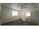 Bedroom with built in cabinets, ceiling fan, and light from two windows at 704 Lemonwood Dr, Oldsmar, FL 34677