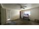 A bedroom with a closet, desk, ceiling fan and windows at 704 Lemonwood Dr, Oldsmar, FL 34677