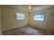 Bedroom with fan and view of backyard from window at 704 Lemonwood Dr, Oldsmar, FL 34677