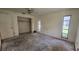 Bedroom with closet space and windows for natural light at 704 Lemonwood Dr, Oldsmar, FL 34677