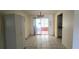 Dining area with tile floor and sliding door to sun room at 704 Lemonwood Dr, Oldsmar, FL 34677