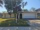 Charming single-story home with a well-maintained lawn and inviting curb appeal at 704 Lemonwood Dr, Oldsmar, FL 34677