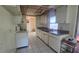Functional kitchen with essential appliances and ample counter space and view to dining area at 704 Lemonwood Dr, Oldsmar, FL 34677