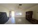 Spacious living room with tile floors, ceiling fan, and furniture at 704 Lemonwood Dr, Oldsmar, FL 34677