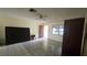The living room features tile flooring and a ceiling fan at 704 Lemonwood Dr, Oldsmar, FL 34677