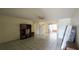 Bright living room featuring tile floors, ceiling fan, and furniture at 704 Lemonwood Dr, Oldsmar, FL 34677