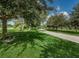 Picturesque walking path through a community green space and along a waterfront provides a scenic escape at 704 Lemonwood Dr, Oldsmar, FL 34677
