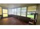 The sun room features many windows and plenty of natural light at 704 Lemonwood Dr, Oldsmar, FL 34677