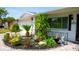 Close up on a cozy front yard with lush greenery, a paver walkway, and a charming statue at 7321 San Moritz Dr, Port Richey, FL 34668