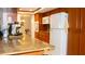 Kitchen with wood cabinetry, a breakfast bar, and stainless steel appliances at 7321 San Moritz Dr, Port Richey, FL 34668