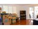 Bright living room with hardwood floors, white plantation shutters and access to the backyard at 7321 San Moritz Dr, Port Richey, FL 34668