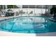 Covered pool featuring lounge chairs and outdoor shade at 7321 San Moritz Dr, Port Richey, FL 34668