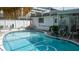 Covered pool featuring sunshades and outdoor seating at 7321 San Moritz Dr, Port Richey, FL 34668