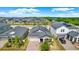 Aerial view of a charming home with solar panels, showcasing its sustainable design and modern appeal at 7336 Bagley Cove Ct, Sun City Center, FL 33573