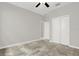 Cozy bedroom with carpet, ceiling fan and closet, ideal for relaxation at 7336 Bagley Cove Ct, Sun City Center, FL 33573