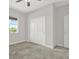 Bedroom with closet, carpet and natural light from the window, perfect for a comfortable living space at 7336 Bagley Cove Ct, Sun City Center, FL 33573
