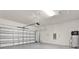 Spacious garage with an overhead door and water heater, offering convenience and storage at 7336 Bagley Cove Ct, Sun City Center, FL 33573