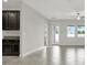 Spacious living area adjacent to the kitchen, featuring tile flooring and large windows for natural light at 7336 Bagley Cove Ct, Sun City Center, FL 33573