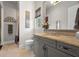Elegant bathroom featuring granite countertops, a large mirror, and a separate shower area at 7775 Still Lakes Dr, Odessa, FL 33556