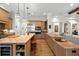 Open kitchen with eat-in island, stainless appliances and view to the living area at 7775 Still Lakes Dr, Odessa, FL 33556