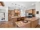 Spacious kitchen features stainless steel appliances, wood cabinetry and granite countertops at 7775 Still Lakes Dr, Odessa, FL 33556