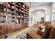 Cozy living room with custom built-in bookshelves and comfortable leather chairs at 7775 Still Lakes Dr, Odessa, FL 33556