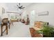 Another angle of the spacious and sunlit living room with stylish furniture and a vaulted ceiling at 7775 Still Lakes Dr, Odessa, FL 33556