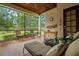 Relaxing screened porch with tiled floors and views of the well maintained backyard and gardens at 7775 Still Lakes Dr, Odessa, FL 33556