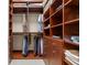 Spacious walk-in closet with custom shelving and ample storage space at 7775 Still Lakes Dr, Odessa, FL 33556