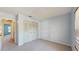 Spacious bedroom with closet storage, carpet flooring, and an entrance hallway at 7802 Hardwick Dr # 1126, New Port Richey, FL 34653