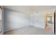 Bright bedroom with a ceiling fan, carpet flooring, and ample natural light from a window at 7802 Hardwick Dr # 1126, New Port Richey, FL 34653