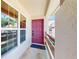 Charming raspberry front door with a window and a view of the exterior at 7802 Hardwick Dr # 1126, New Port Richey, FL 34653