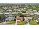 Aerial view of the property in a residential neighborhood near a body of water at 8408 Flagstone Dr, Tampa, FL 33615