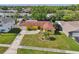 Aerial view showcasing a well-manicured lawn and mature landscaping at 8408 Flagstone Dr, Tampa, FL 33615