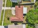 Birds eye view shows the location, with mature trees, and neighboring homes at 8408 Flagstone Dr, Tampa, FL 33615